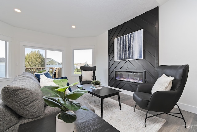 1910 W Campo Ln, Eagle, ID 83616 - living room featuring a fireplace, wood finished floors, baseboards, and recessed lighting