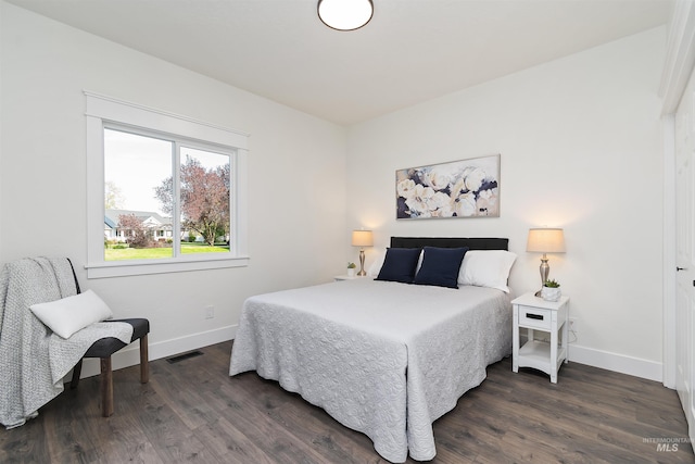 1910 W Campo Ln, Eagle, ID 83616 - bedroom featuring baseboards and dark wood finished floors