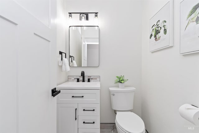 1910 W Campo Ln, Eagle, ID 83616 - bathroom with toilet, vanity, and tasteful backsplash