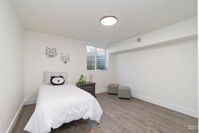1910 W Campo Ln, Eagle, ID 83616 - bedroom featuring baseboards and wood finished floors