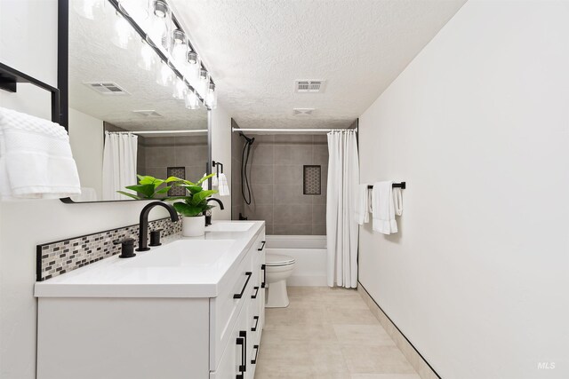 1910 W Campo Ln, Eagle, ID 83616 - full bath featuring vanity, a textured ceiling, shower / bath combo with shower curtain, toilet, and baseboards