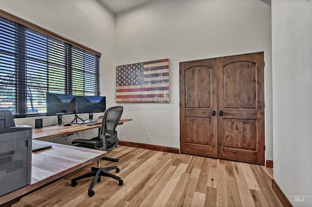 office space featuring wood finished floors and baseboards