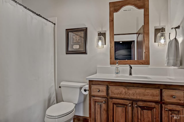 bathroom with a shower with shower curtain, visible vents, toilet, and vanity