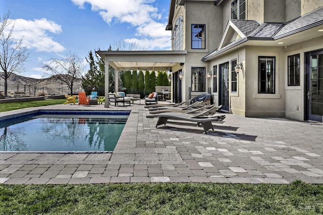 view of pool featuring a patio, fence, and a fenced in pool