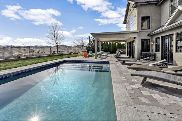 view of swimming pool with a fenced in pool, a patio, an outdoor hangout area, and a fenced backyard