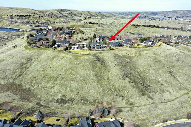 drone / aerial view featuring a mountain view and a residential view