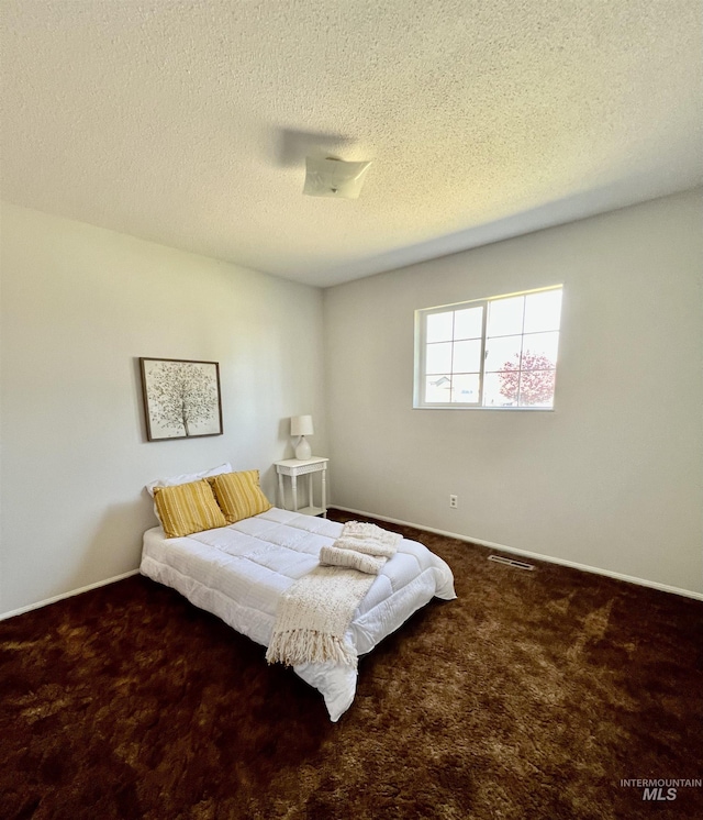 2025 10th Ave, Clarkston, WA 99403 - bedroom featuring carpet, a textured ceiling, and baseboards
