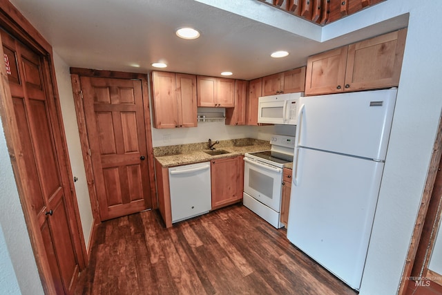 1607 Davis Ave Unit C2, Mccall, ID 83638 - kitchen with white appliances, a sink, dark wood-style flooring, recessed lighting, and light stone countertops