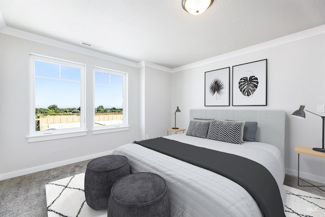 bedroom with ornamental molding, carpet, and baseboards