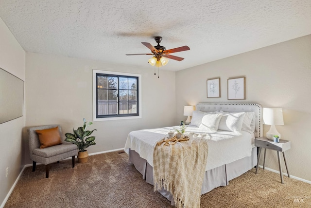 bedroom with carpet floors, a ceiling fan, baseboards, and a textured ceiling