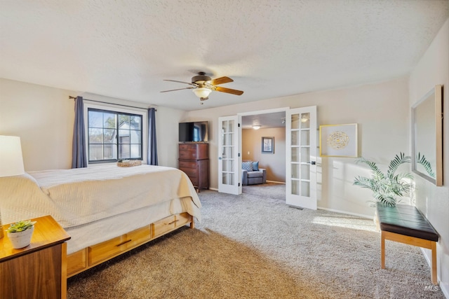 carpeted bedroom with ceiling fan, baseboards, a textured ceiling, and french doors