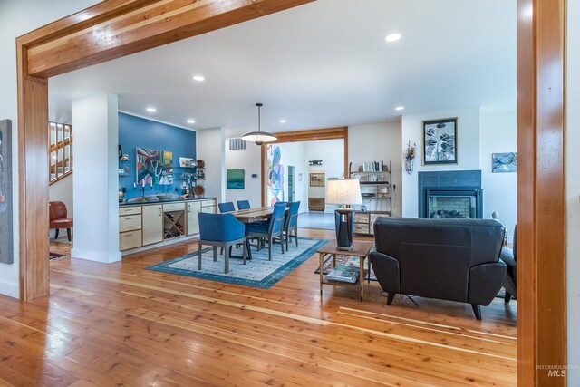 2809 Hampton Ct, Moscow, ID 83843 - dining room with hardwood / wood-style floors, recessed lighting, a fireplace, and stairway
