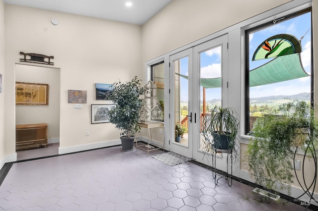 2809 Hampton Ct, Moscow, ID 83843 - entryway with baseboards, french doors, recessed lighting, and dark tile patterned flooring