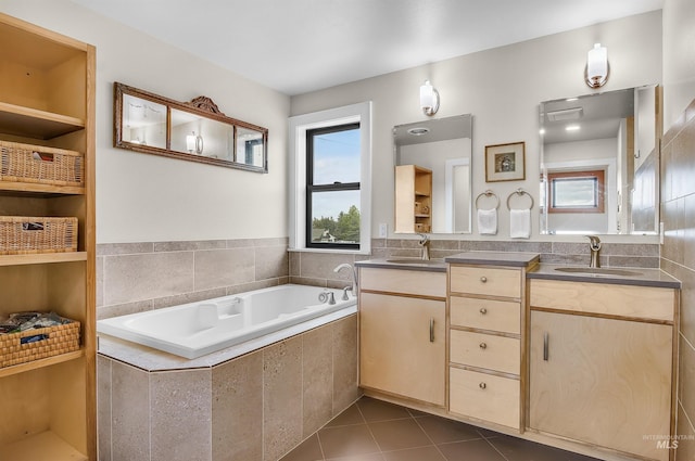 2809 Hampton Ct, Moscow, ID 83843 - bathroom with double vanity, a garden tub, and tile patterned flooring
