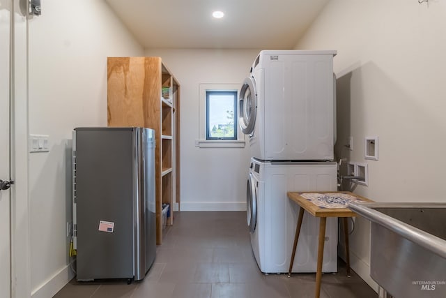 2809 Hampton Ct, Moscow, ID 83843 - laundry room featuring stacked washer and clothes dryer and baseboards