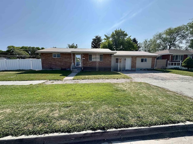 2101 Albion Ave, Burley, ID 83318 - single story home with brick siding, metal roof, and driveway