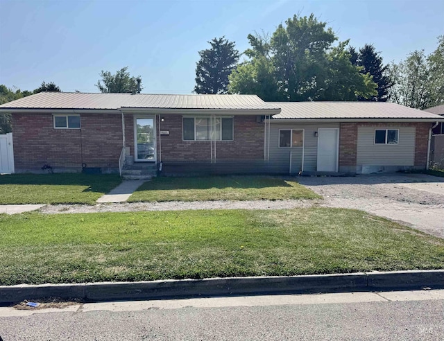2101 Albion Ave, Burley, ID 83318 - ranch-style home featuring a front yard, brick siding, metal roof, and entry steps