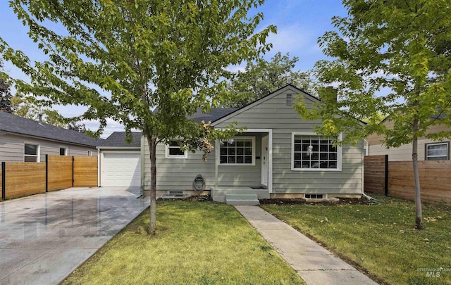 view of front facade with a front yard and a garage