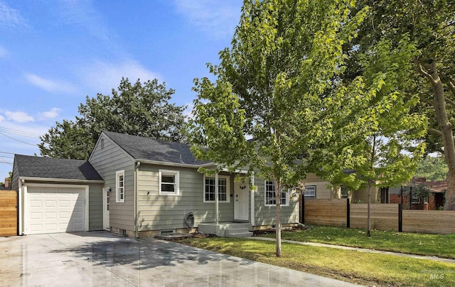 view of front of property featuring a garage and a front yard