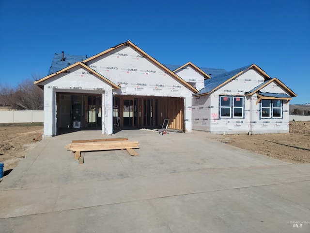 property under construction with driveway and an attached garage