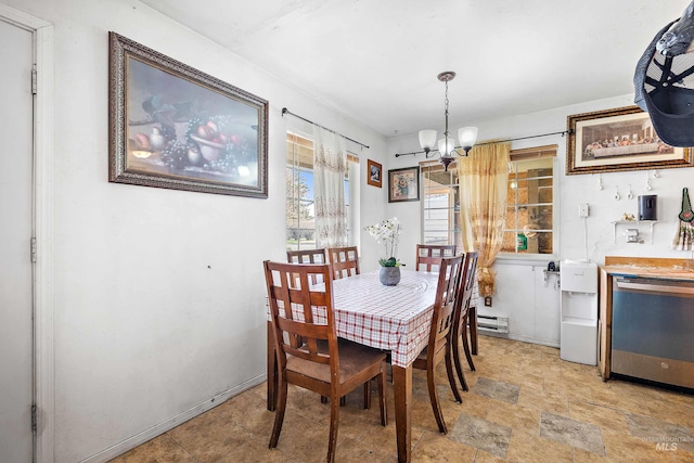 tiled dining space featuring a notable chandelier