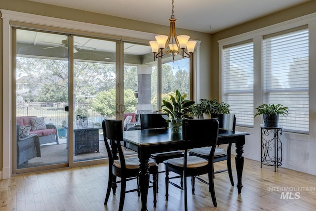 3214 S Arctic Fox Ave, Eagle, ID 83616 - dining space with wood finished floors, healthy amount of natural light, and a chandelier