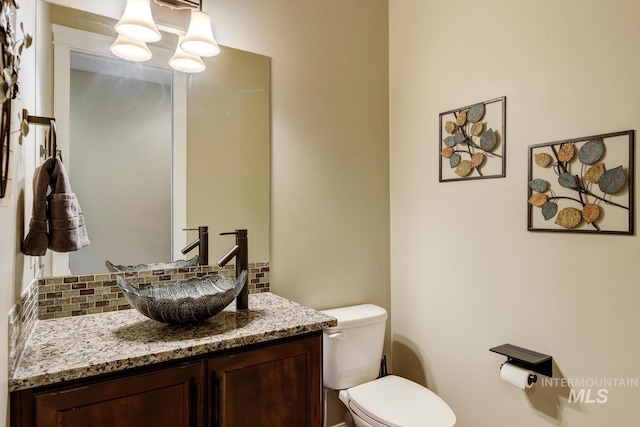 3214 S Arctic Fox Ave, Eagle, ID 83616 - bathroom featuring tasteful backsplash and vanity