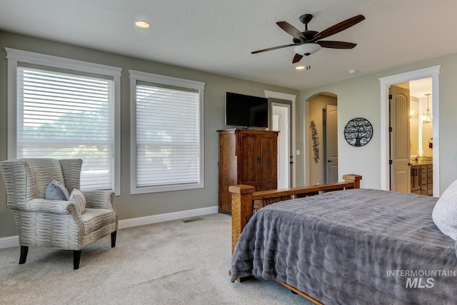 3214 S Arctic Fox Ave, Eagle, ID 83616 - carpeted bedroom with arched walkways, ceiling fan, and recessed lighting