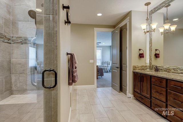 3214 S Arctic Fox Ave, Eagle, ID 83616 - ensuite bathroom featuring a tile shower, vanity, recessed lighting, and a chandelier