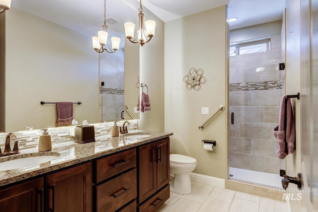 3214 S Arctic Fox Ave, Eagle, ID 83616 - bathroom featuring double vanity, a shower stall, a chandelier, and tile patterned flooring