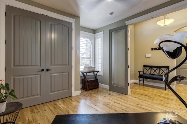 3214 S Arctic Fox Ave, Eagle, ID 83616 - foyer entrance with light wood-style flooring and baseboards