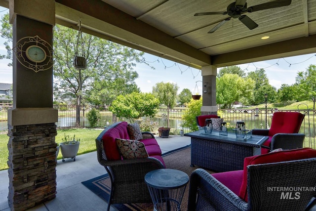 3214 S Arctic Fox Ave, Eagle, ID 83616 - fenced backyard featuring a ceiling fan, a patio area, and a water view