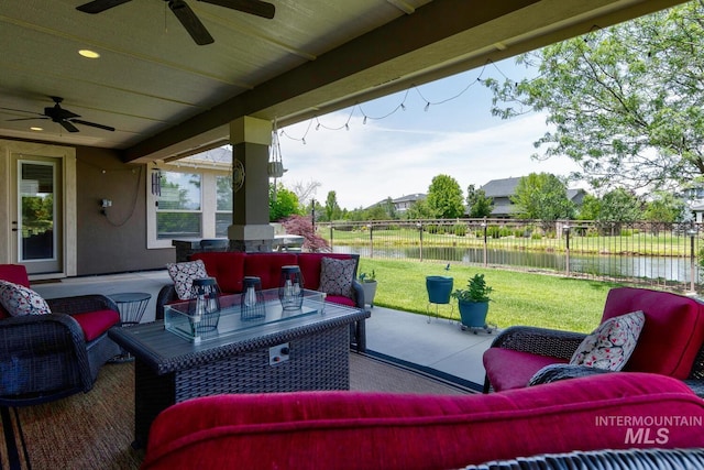 3214 S Arctic Fox Ave, Eagle, ID 83616 - fenced backyard with a ceiling fan, a water view, an outdoor living space, and a patio