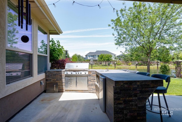 3214 S Arctic Fox Ave, Eagle, ID 83616 - view of patio / terrace featuring an outdoor kitchen