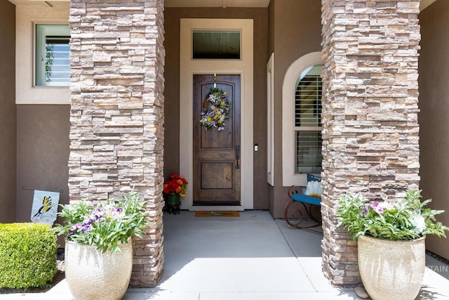 3214 S Arctic Fox Ave, Eagle, ID 83616 - property entrance featuring stone siding and stucco siding