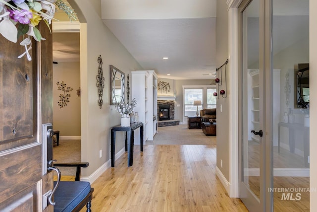 3214 S Arctic Fox Ave, Eagle, ID 83616 - foyer entrance featuring light wood-style floors, a fireplace, and recessed lighting
