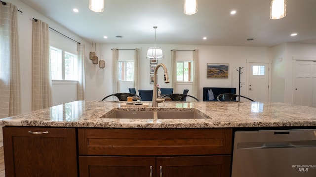 1147 Driscoll Ridge Rd, Troy, ID 83871 - kitchen featuring stainless steel dishwasher, a sink, plenty of natural light, light stone counters, and recessed lighting