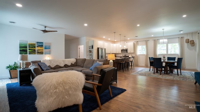 1147 Driscoll Ridge Rd, Troy, ID 83871 - living room featuring wood finished floors, recessed lighting, ceiling fan, and baseboards