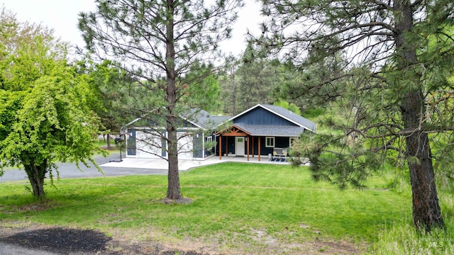 1147 Driscoll Ridge Rd, Troy, ID 83871 - view of front of house with a front yard and covered porch