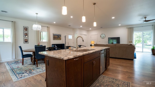 1147 Driscoll Ridge Rd, Troy, ID 83871 - kitchen with a sink, stainless steel dishwasher, wood finished floors, open floor plan, and decorative light fixtures