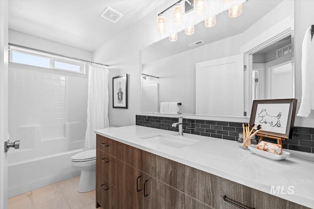 full bathroom featuring vanity, decorative backsplash, shower / bath combination with curtain, and toilet