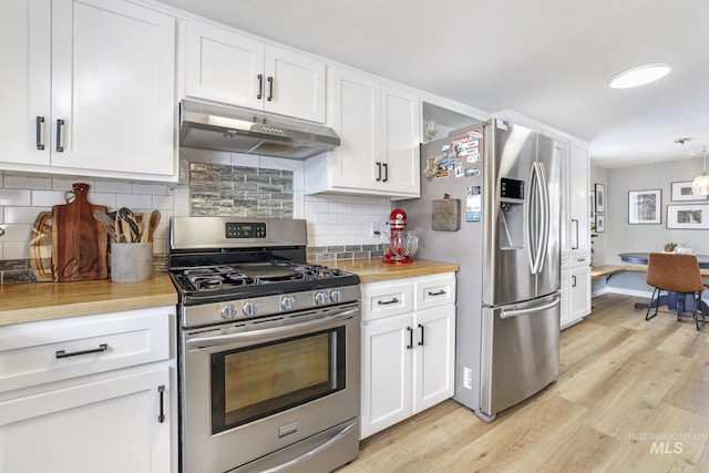 kitchen featuring stainless steel appliances, light wood-style floors, white cabinets, and under cabinet range hood