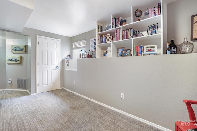 carpeted bedroom with baseboards and visible vents