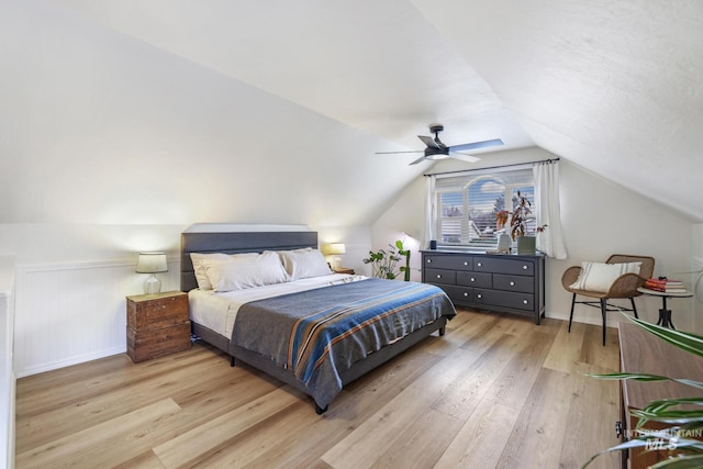 bedroom featuring ceiling fan, vaulted ceiling, and hardwood / wood-style flooring