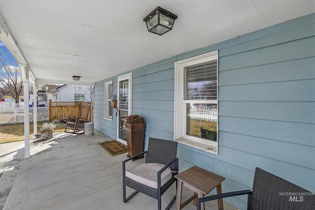 view of patio / terrace featuring fence