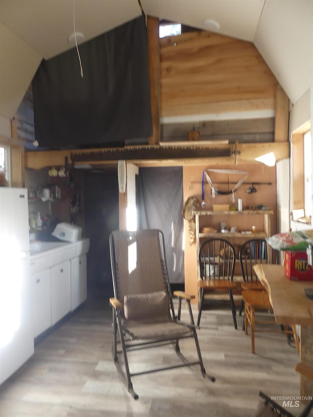 309 Wildrose Ln, Anatone, WA 99401 - dining area featuring light hardwood / wood-style flooring and vaulted ceiling