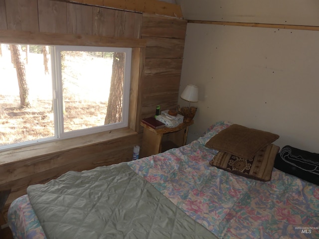 309 Wildrose Ln, Anatone, WA 99401 - bedroom with multiple windows and wood walls