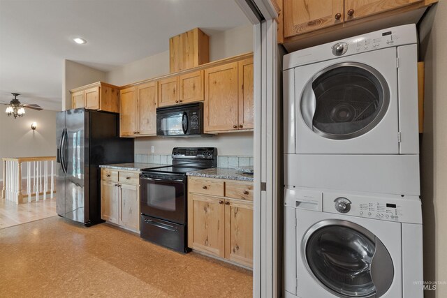 1141 Liberty Dr, Clarkston, WA 99403 - kitchen featuring black appliances, stacked washer and clothes dryer, a ceiling fan, light stone countertops, and light brown cabinets