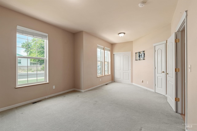 1141 Liberty Dr, Clarkston, WA 99403 - spare room with healthy amount of natural light, a smoke detector, light carpet, and baseboards