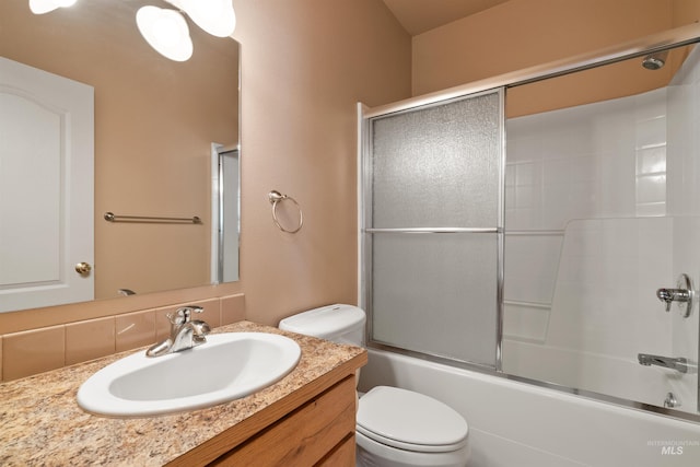 1141 Liberty Dr, Clarkston, WA 99403 - full bathroom with toilet, vanity, shower / bath combination with glass door, and tasteful backsplash